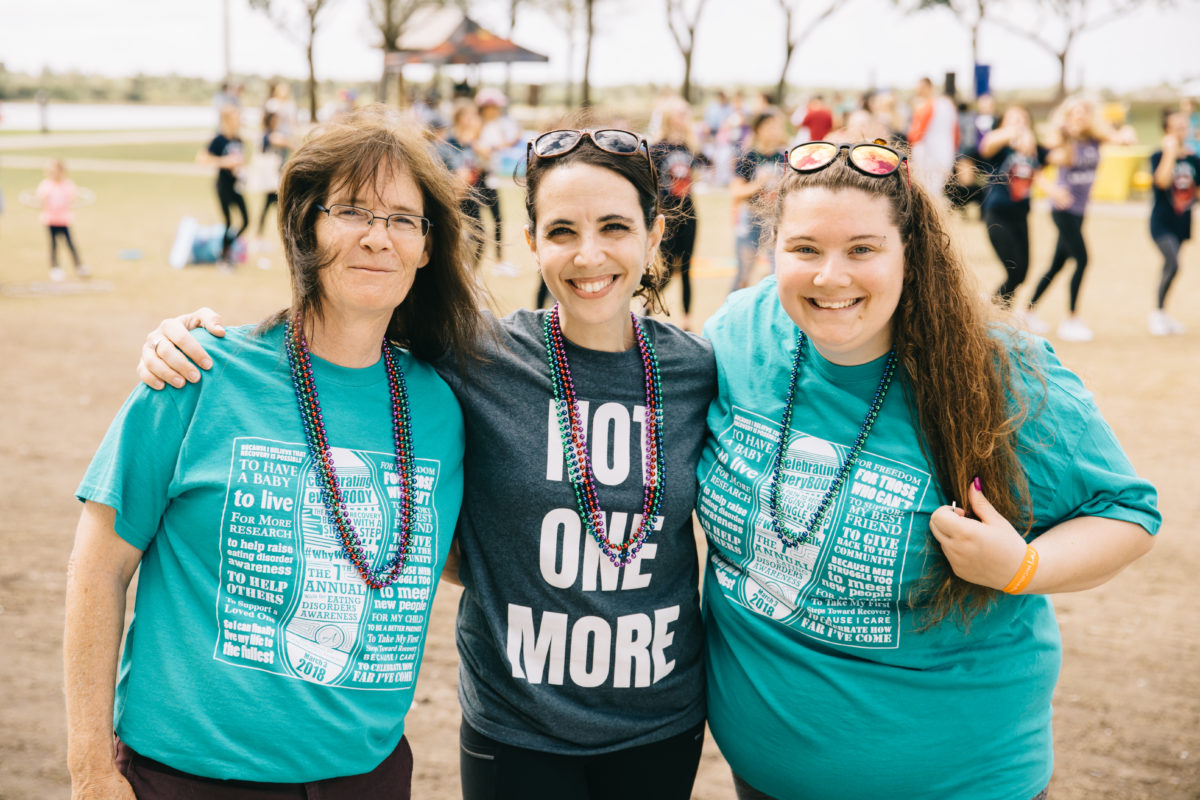 Three women smiling