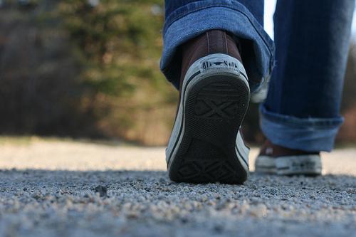 image of sneakers walking down a rocky road