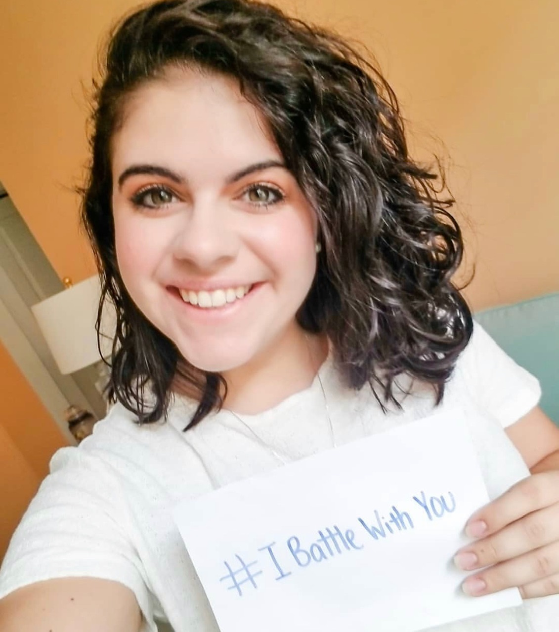 image of a young girl holding a sign that says i battle with you