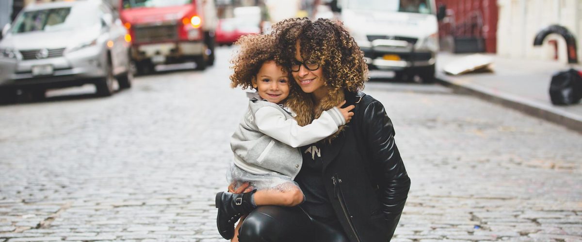 image of a mother and daughter posing in the street