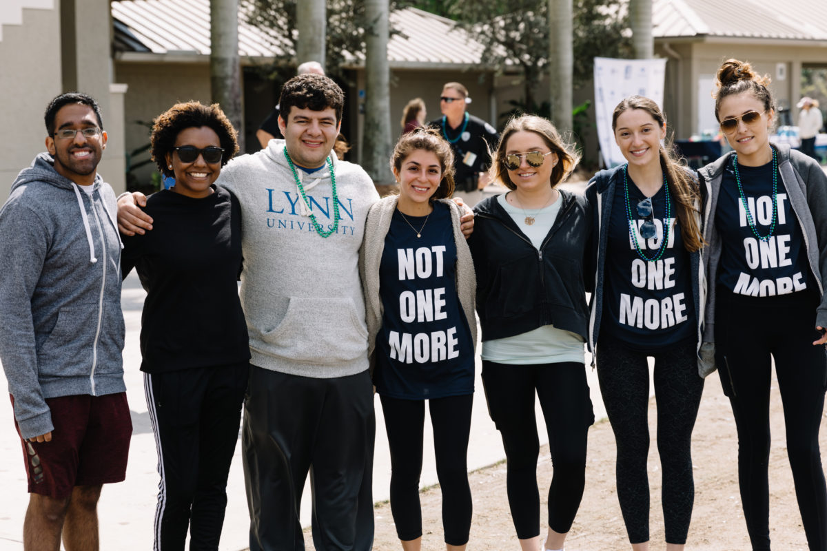 image of students posing together for the not one more event