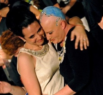 image of a woman with cancer hugging another woman