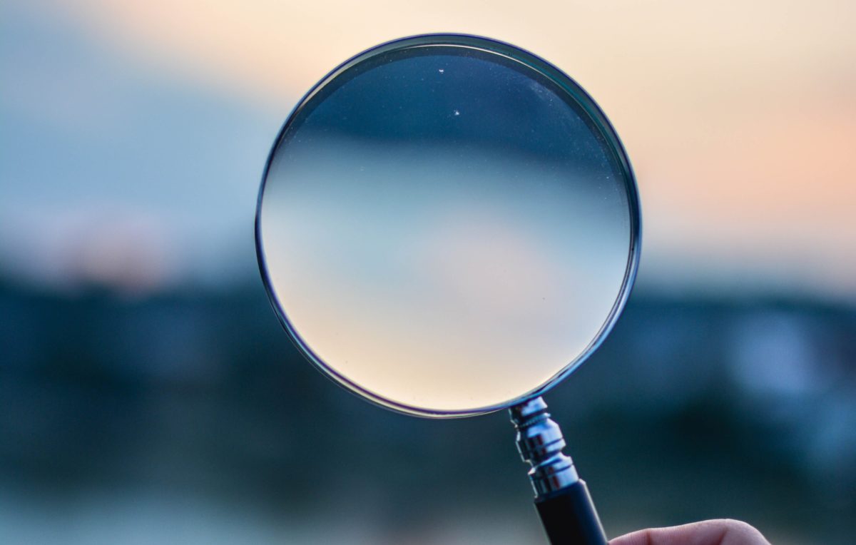 selective focus photo of magnifying glass