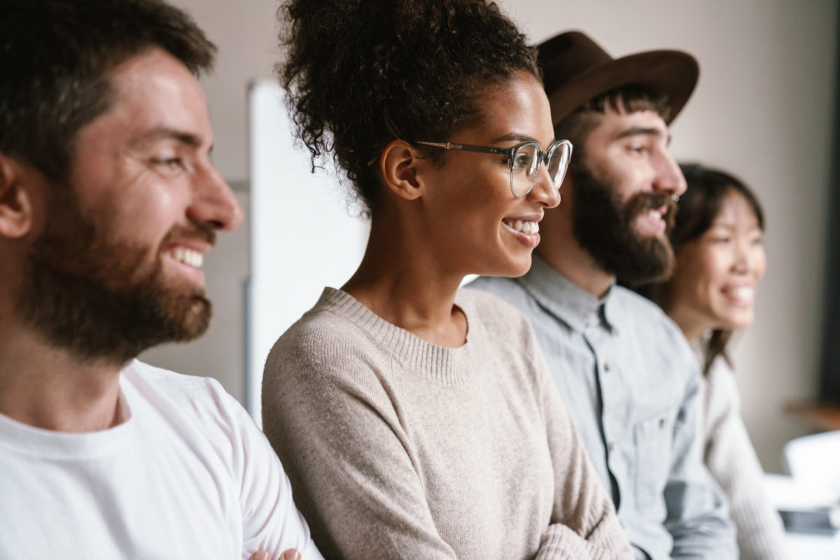 multiethnic young business workers standing together at office