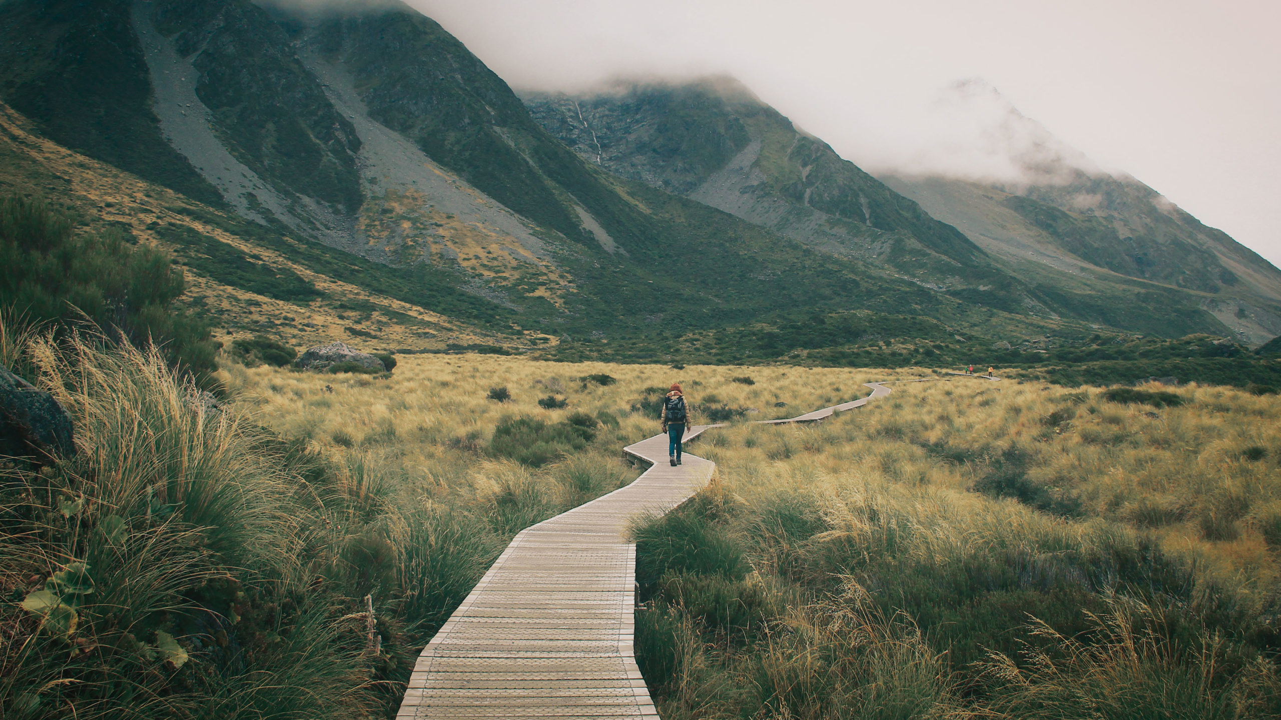 BOARDWALK LEADING TOWARDS MOUNTAINS