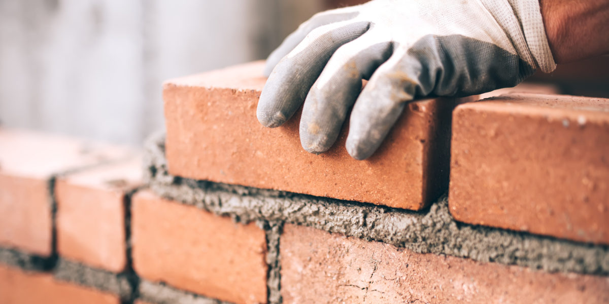 A builder works on a construction project