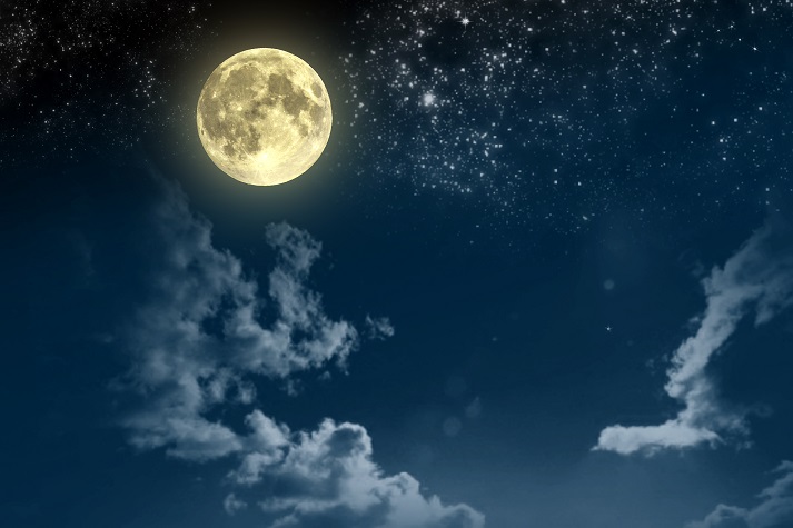 Beautiful magic blue night sky with clouds and full moon and stars