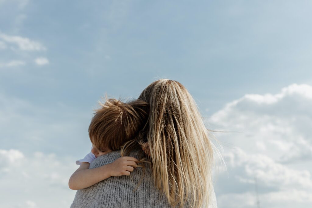 mother and child with sky in background