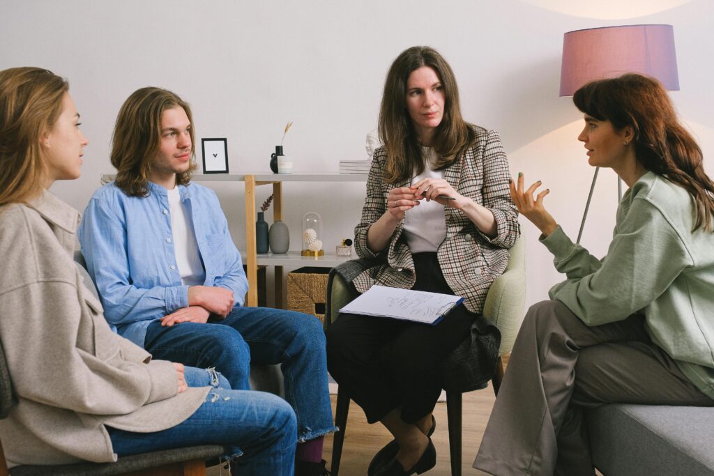 High-angle shot of people in a circle discussing intently.