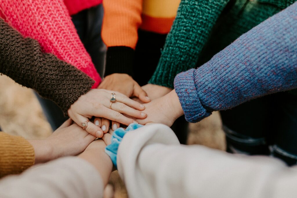 Close up of hands coming together